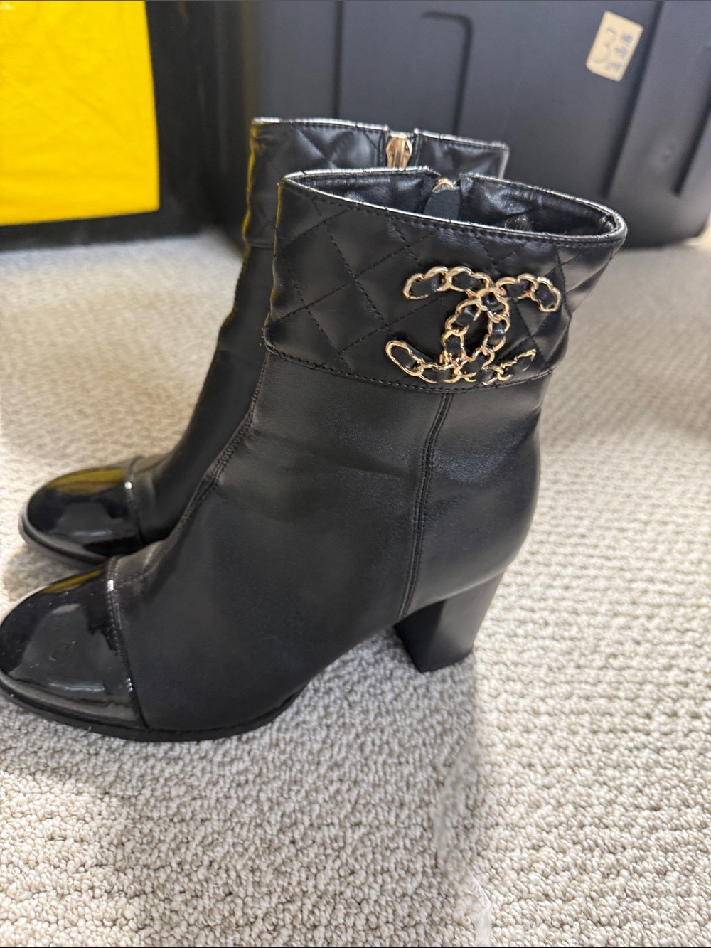 CHANEL Black Leather Quilted Cuff Ankle Boots with Gold CC Chain